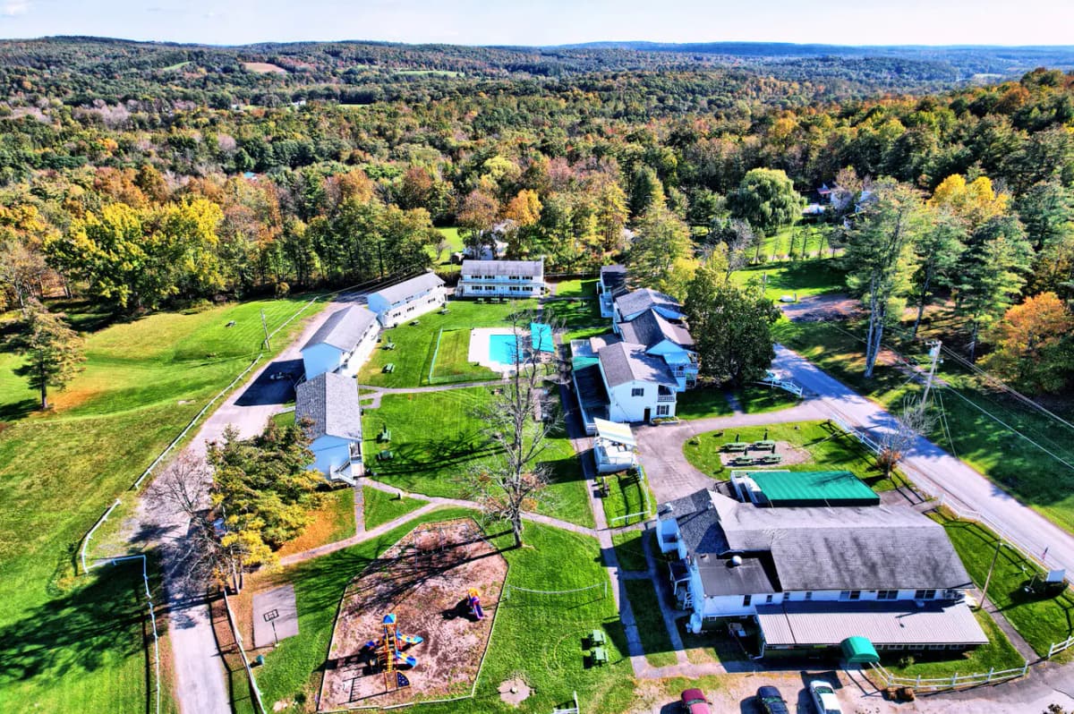 Aerial view of Gavin's Irish Country Inn and its 20 acres surrounded by fall foliage in the Northern Catskills