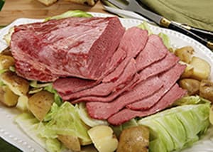 Sliced corned beef with cabbage and potatoes on a platter at Gavin's