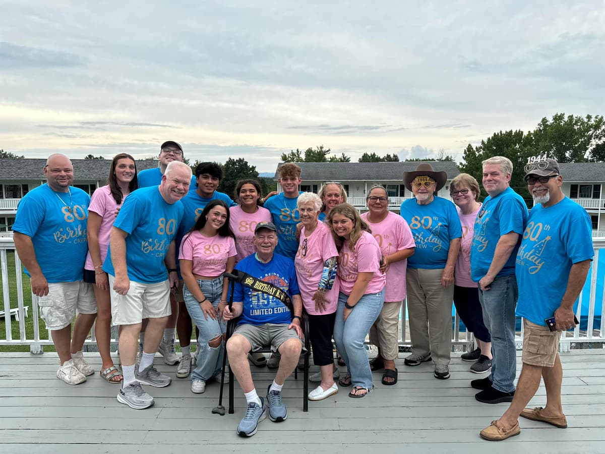 A family group in matching shirts on the deck at Gavin's for Father's Day weekend 2025