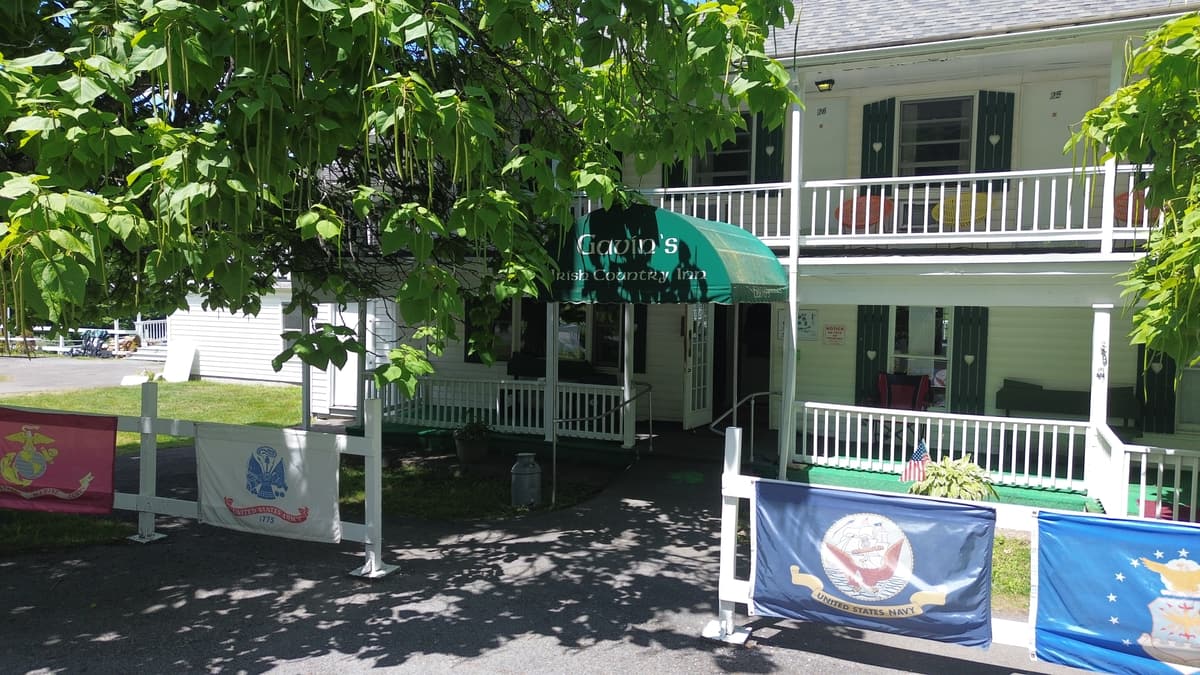 The white farmhouse porch and main lobby entrance at Gavin's Irish Country Inn, Cornwallville NY