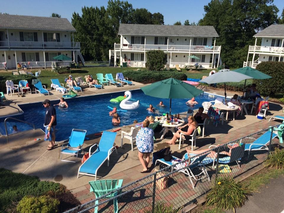 Guests relaxing on the pool deck on a summer day at Gavin's in East Durham NY