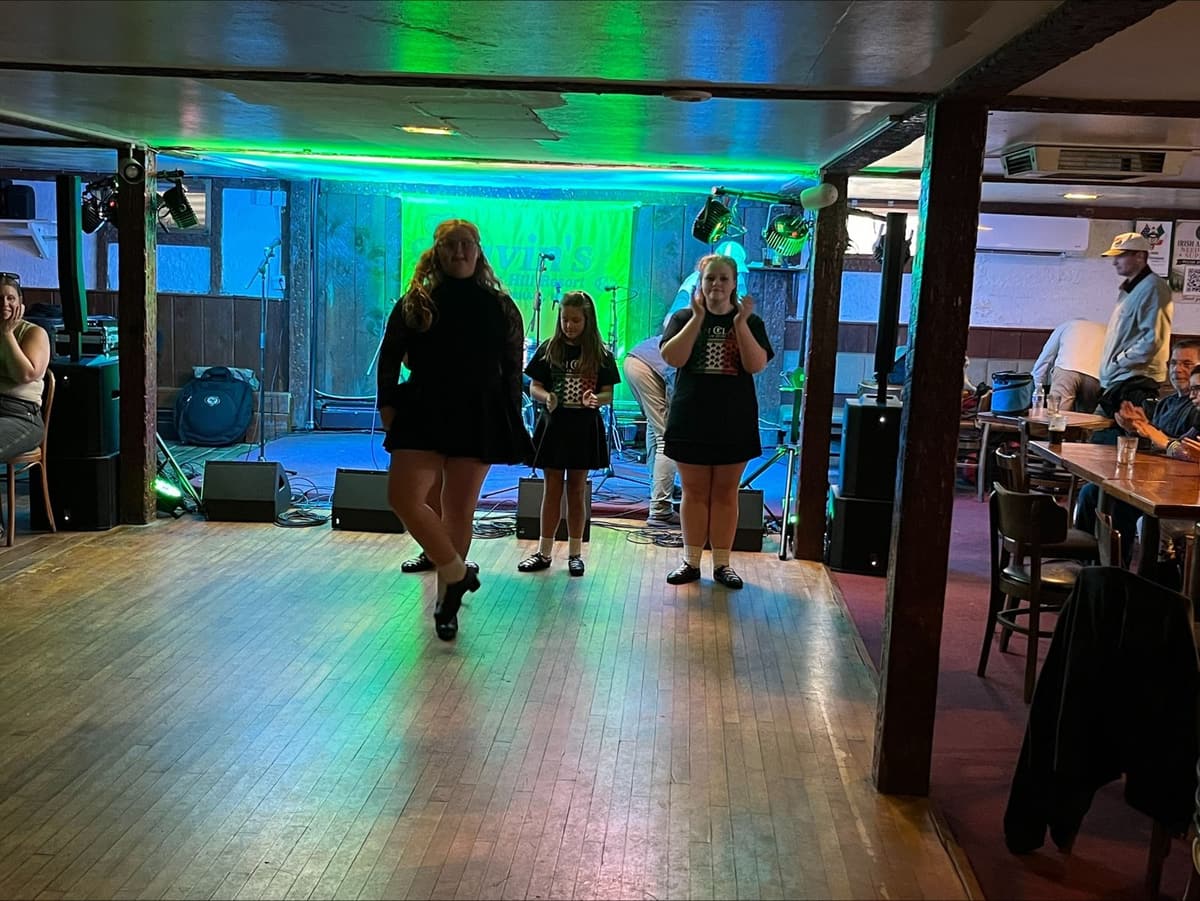 Three Irish step dancers on the pub floor during Guinness Fest at Gavin's