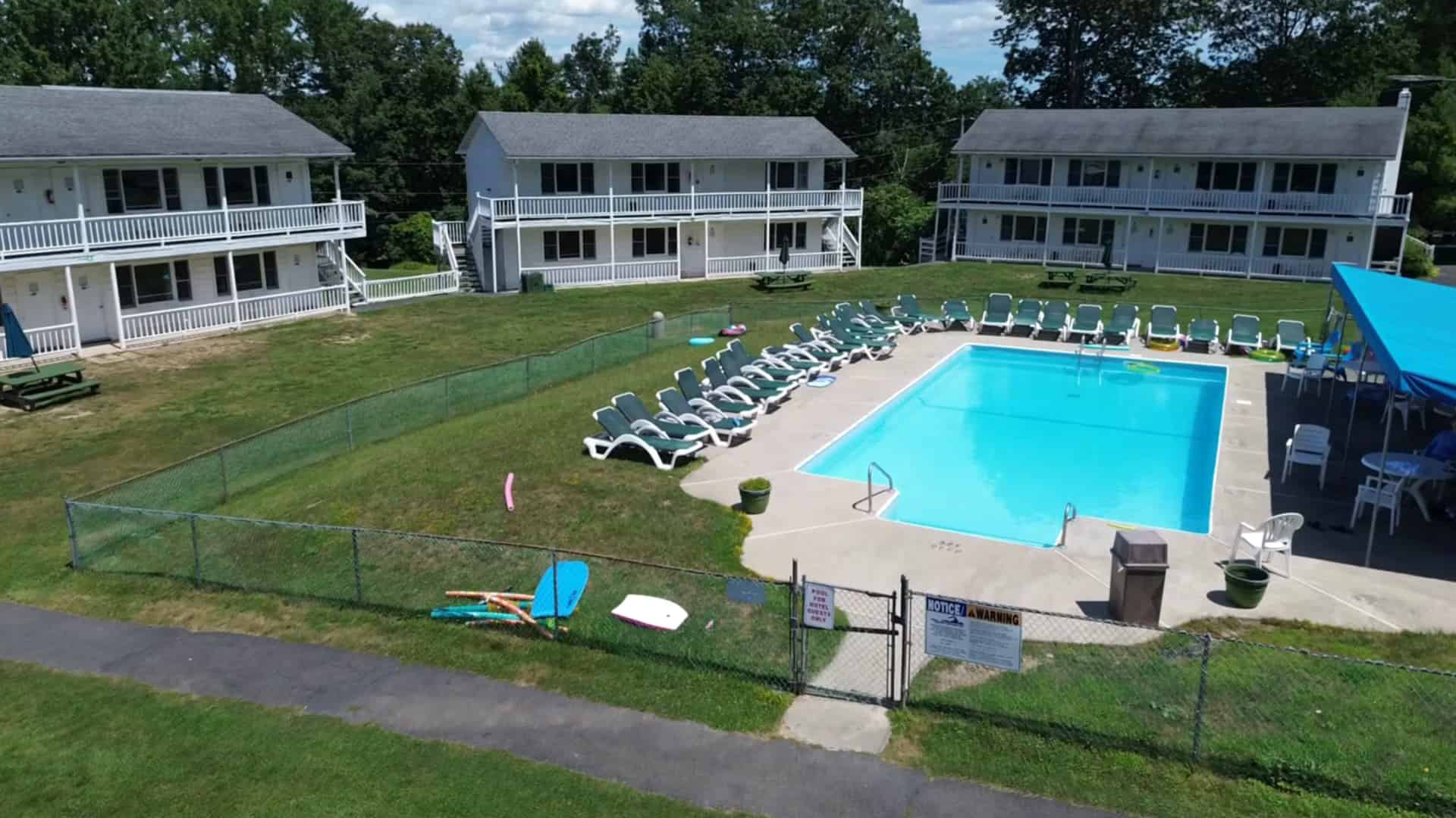 Aerial view of the heated pool and guest buildings at Gavin's Irish Country Inn on a summer day