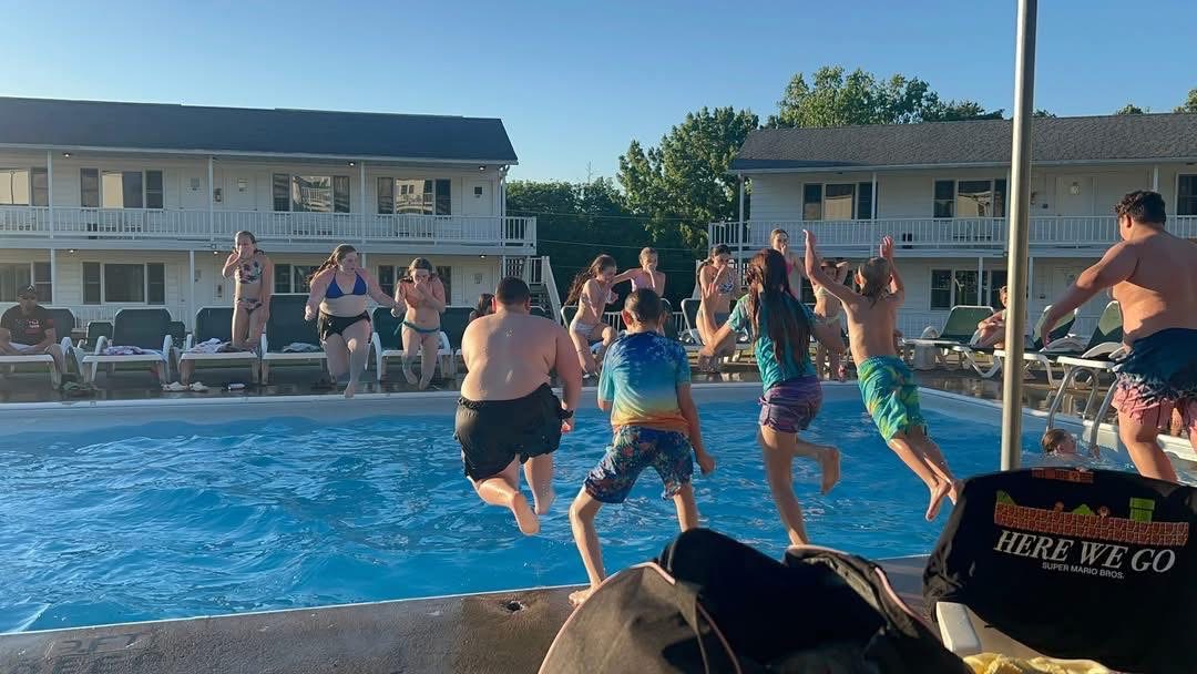 Families enjoying the outdoor heated pool at Gavin's Irish Country Inn in the Catskills
